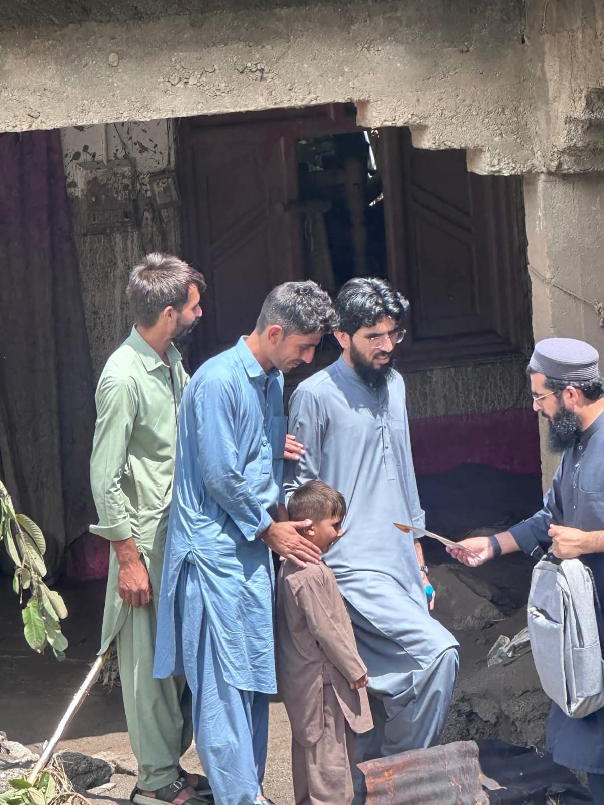 Al-Irshad Foundation relief team providing direct cash assistance and aid to flood-affected families